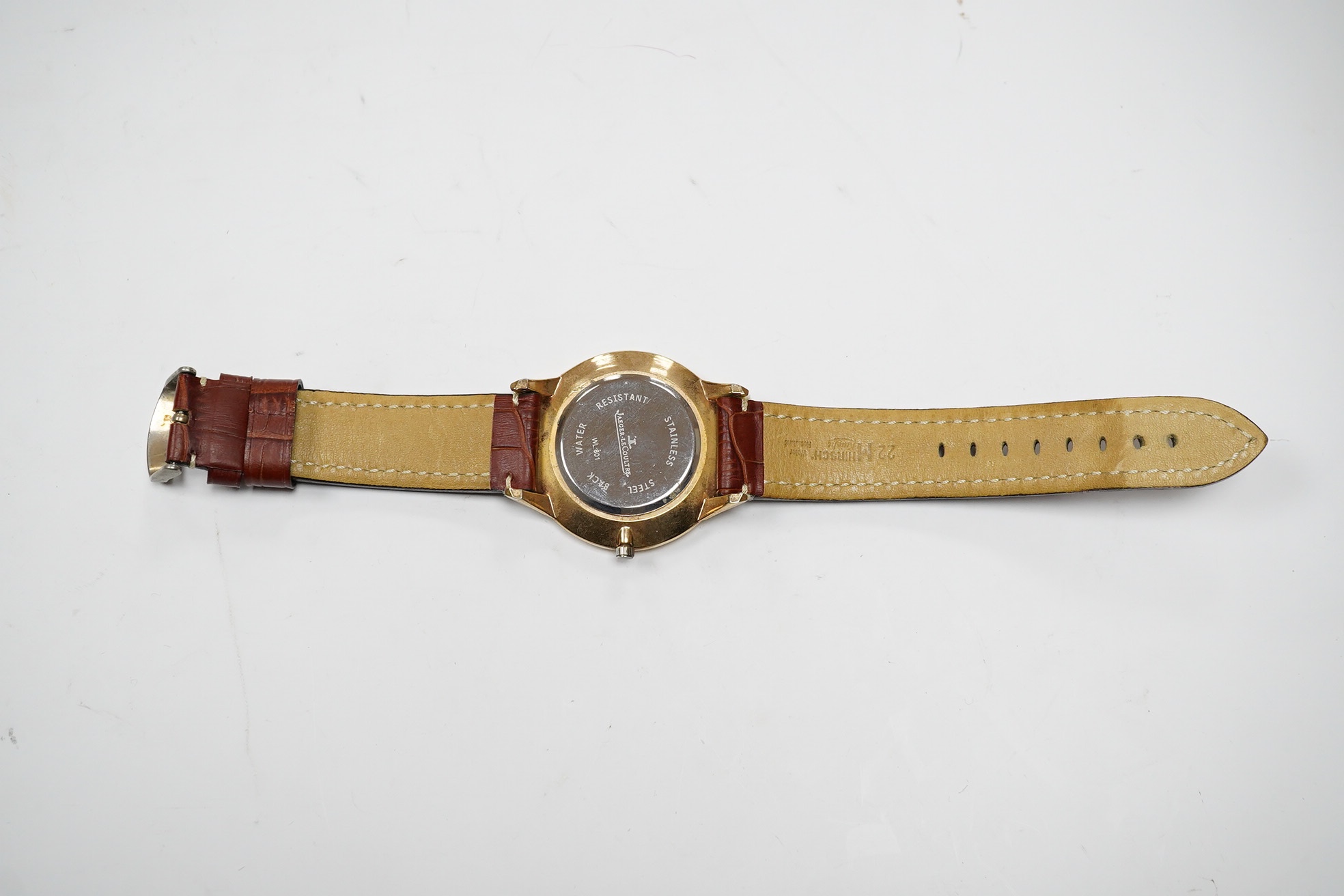 A gentleman's steel and gold plated Jaeger LeCoultre Master Grand Ultra Slim manual wind wrist watch, with black dial and subsidiary seconds, case diameter 45mm, on an associated leather strap. Condition - poor.